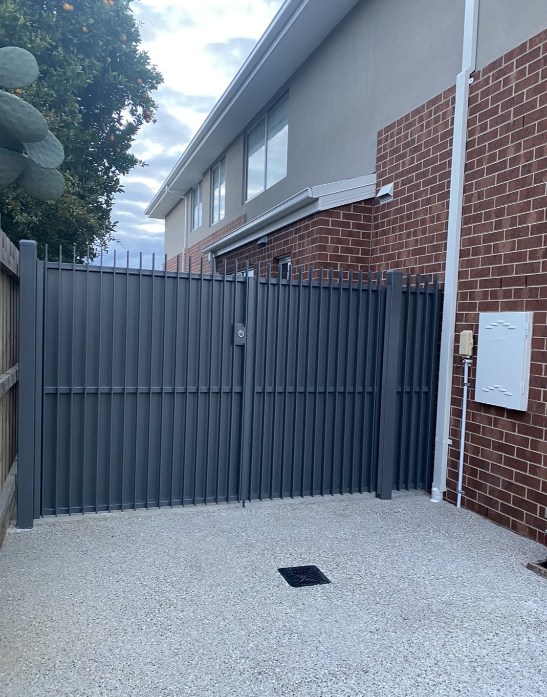 Grey vertical slat double metal gates