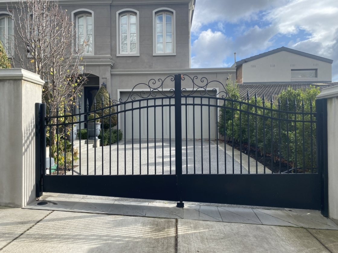 Custom ornate black metal driveway gates