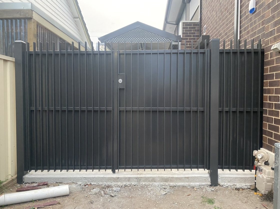 Black slat metal privacy double gates