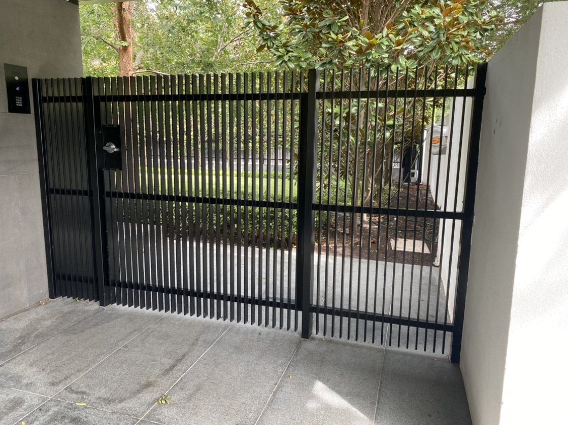 Black sliding vertical bar metal gate
