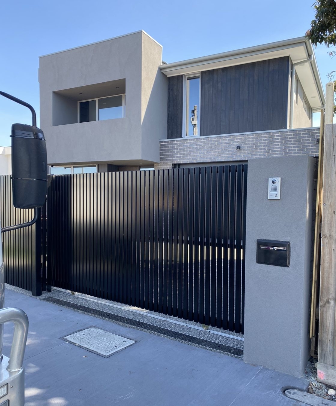 Black sliding privacy gate at a contemporary Melbourne house