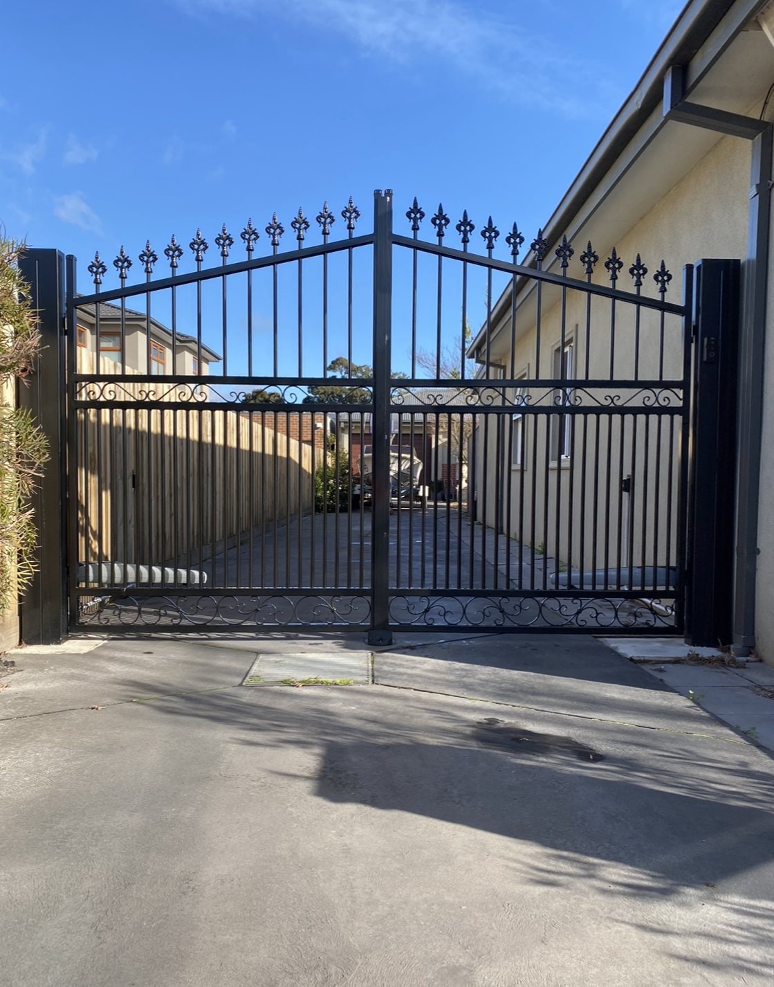 Black spear-top ornamental driveway double gates