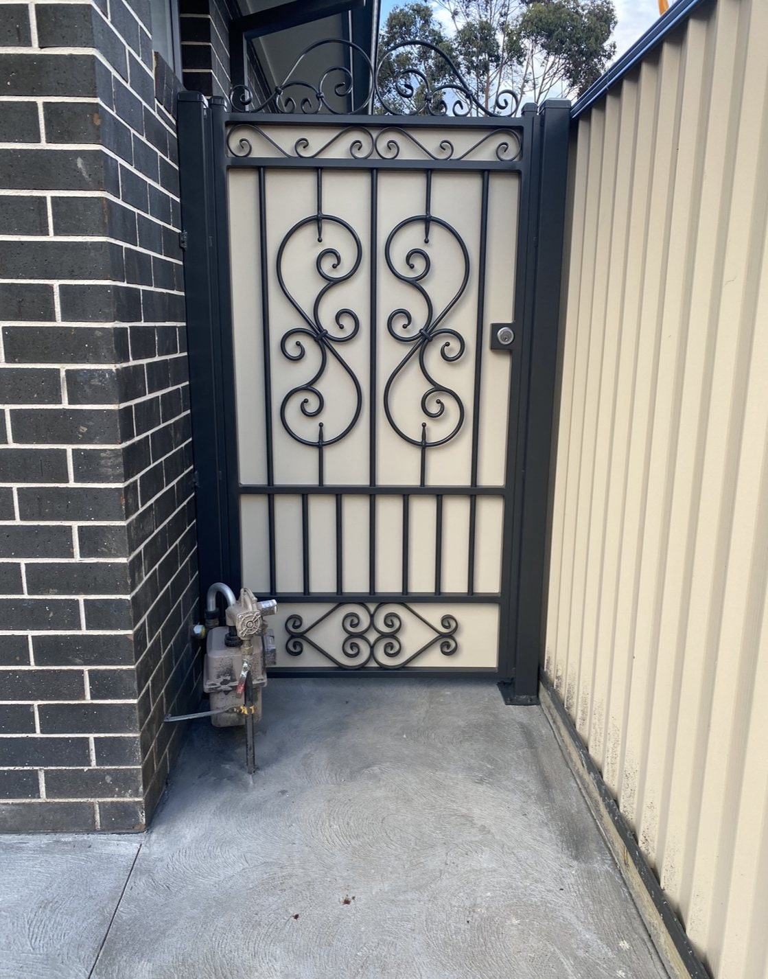 Black scrollwork metal side gate