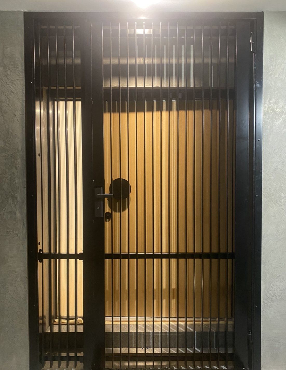 Black vertical bar security entry gate